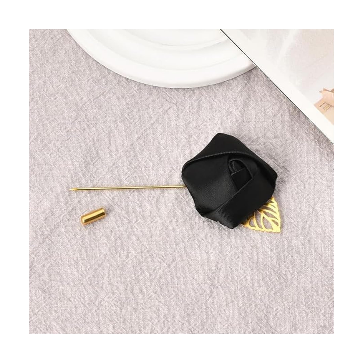Rose Lapel Pin — Black pin with detached protective cap